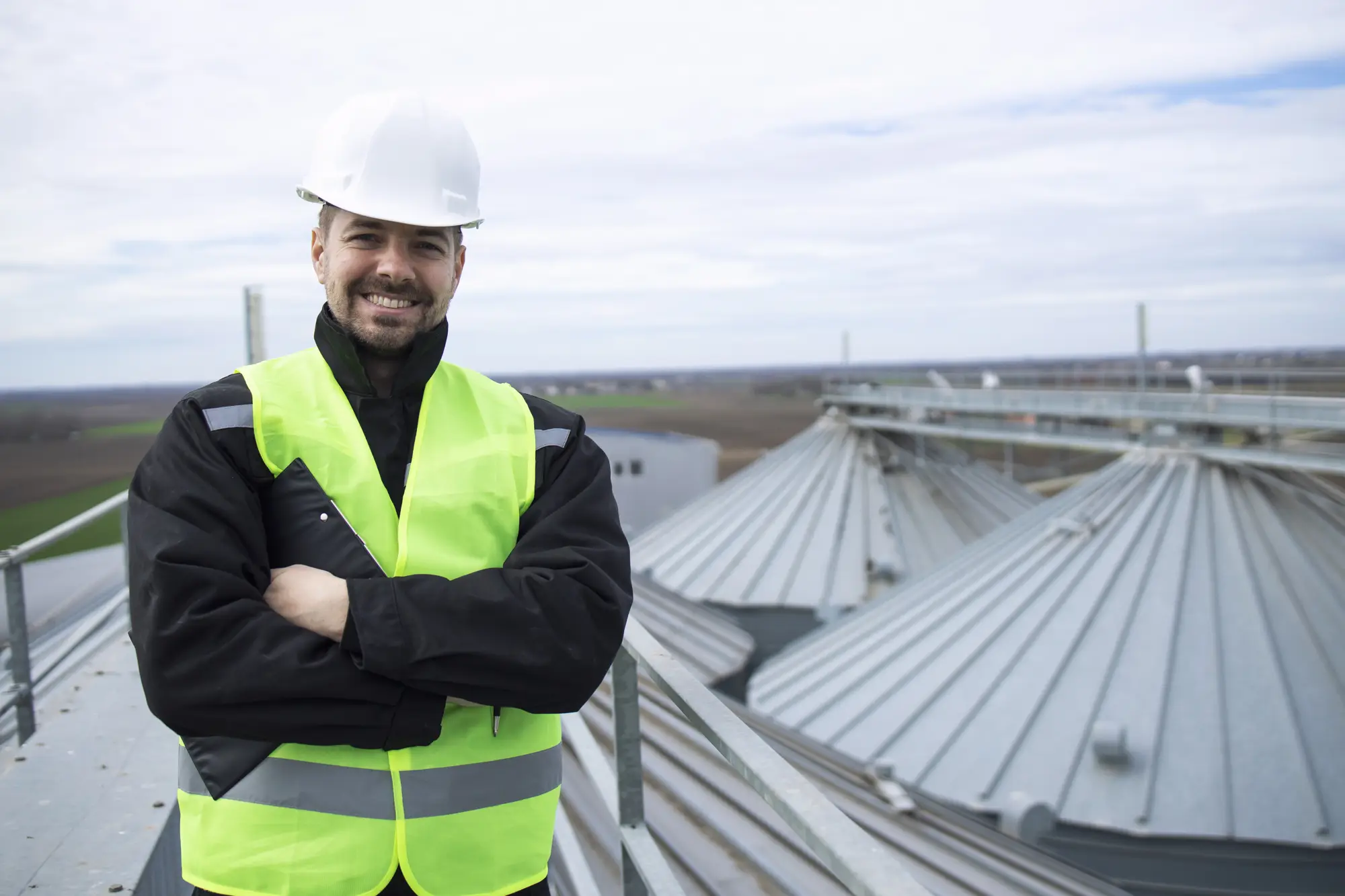 Roofing professional on a metal roof